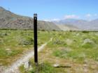 The Pacific Crest Trail is a 2,650 mile  National Trail system that runs from Mexico to Canada , through California, Oregon, and Washington. 