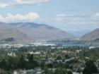 Looking north up the Columbia River, from Skyline Drive in Wenatchee.  If you click on the image to enlarge you can see the Odabashian Bridge about the center of the photo and the Rocky Reach Dam in the distance.