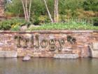 Trilogy is planned community that has been in the works for close to 20 years.  It features a full 18 hole golf course, walking and biking trails, shopping and service centers,  and an extremely active 55 + community center.  