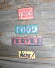 Good Food Served Here. Sign on the side of Our Deck Down Under. And it's true!