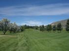 Looking up the long, par 5, #9 fairway at the Lake Chelan Municipal Golf Course.