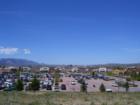 Overlooking the new Southgate shopping center. Downtown Colorado Springs and the Wells Fargo building in the background.
