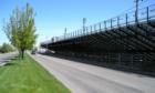 Meridian Speedway bleachers provide thrilling seats, right on Main Street.  They were even more thrilling when they were still made of wood.