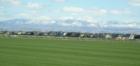 turf farm and new houses south west of Boise, looking towards the Boise Mountains to the northeast