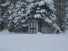 Snow covered shed in Brook Park, MN