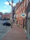 Bow Street in downtown Portsmouth NH - you can really see a bow in the brick buildings along this street as they curve along the street.  On the other side of these buildings is the river that divides New Hampshire and Maine.