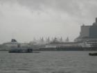 Cruiseships are docked in Coal Harbour on a rainy day.