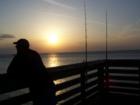 Fisherman at the Ft Island Pier, Crystal River, Florida.  Visit www.crystalsells.com to view real estate for sale in Crystal River.  