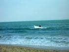 Fishermen beaching their dory after setting their net