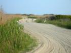 Sand road behind the dunes