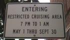 Downtown Naperville Street Sign. Ah, it's summer. And, no you can't go cruising with the top down. Not allowed per the signage.