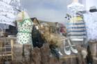 Second hand clothes shop downtown with reflection of Bay Street Village