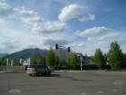 Intersection of Butler and Foxglenn roads – view of Mt. Elden and the San Francisco Peaks as see from the entrance to Foxglenn Park. The townhomes across the intersection are the Spring Meadows group.