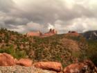 The dark clouds brought in by a Spring storm create contrast that makes the Red Rocks even more dramatic in Uptown Sedona, Arizona.