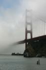 A fog covered Golden Gate Bridge.