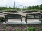 The formal gardens at Longfellow gardens with brick pavers, benches, and beautiful sculpted gardens
