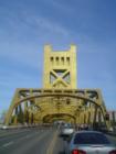 Sacramento's Tower Bridge facing east on West Capitol Ave.  Note the barriers are rising.  (Yes, this is a fully functional drawbridge.)