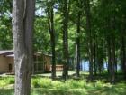 This is the clubhouse (with banquet hall, lounge, indoor pool, a picnic area, and spacious sunny decks) overlooking Fawn Lake.