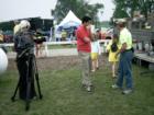 Lights, camera, distraction!  Tim Metcalfe of Sentry Markets fame and head coordinator of the family sponsored Brat Fest prepares for yet another interview in 2007.  (Photo by Art Blanchet of Your Home-Your Money) 