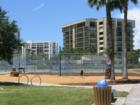 Sank Key Park with simple playground, benches by intercoastal, tennis courts 
