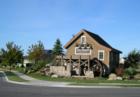 entry into Settlers Bridge from McMillan Road features an old-style waterwheel