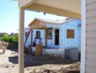 Volunteers for Habitat for Humanity, working on the construction of a home in the Stetson Hills community.