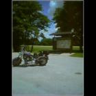 The Harley parked in front of the Great River Road Sign at the rest area near Chester, IL