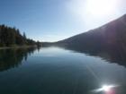 The morning sun coming over the hill on June Lake. Taken from a fishing boat. 