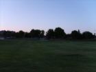 Oasis park at sunset looking from home plate of the baseball field.