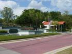 Entrance to this beautifully landscaped gated, golf community.  
