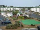 Swimming pool, putting green and picnic area of The Fairways.