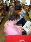 MARSHALL, N.C. The Local Gathering Spot. Neighbors "set a spell" share stories and a newspaper at the country store.