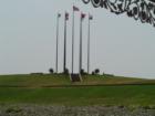 Picture of the flags on Mud Island. A flag is in place for each group that had control over the area at one point or another.