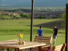 Dine overlooking lush greens after a round of golf.