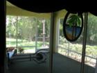 View from a corner unit's lanai. 1296 sf 2 bed plus den, $200's, serene top location, Lee County, FL  