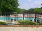 Swimming pool with lake in background