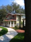 Historic Street with majestic oaks, shows Heritage Oaks Luxury Apartment Complex in the background