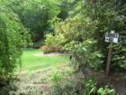 Seen in a Resident's yard in Oyster Bay Cove during a Feng Shui Consultation, the sign says "Lourdes Hill" and a small Grotto was built there.  By Feng Shui Long Island, New York City