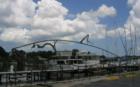 Tarpon Springs Yacht Club boat docks which boasts a Large tarpon fish sculpture