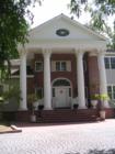 A beautiful entry and a brick driveway