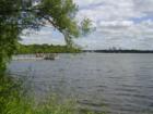City Living - Fishing on Lake Harriet, Downtown Minneapols in the background