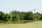 Pond, picnic benches and tables at Bailey's Berry Patch