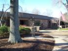 The Academy Street location of the Wake County Library serves central Cary, NC from a park-like setting.