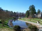 A beautiful community lake in Oxxford Hunt, Cary, NC, provides a gorgeous setting for the Brampton Moors Apartments, and other surrounding residential areas.