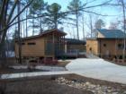 The concession area, with boathouse, deck, and screened porch, complete with rocking chairs, are new in 2007 for Fred G. Bond Park in Cary, NC.