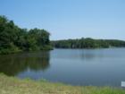 Community Lake in MacGregor Downs, Cary, NC.  "Fishing for Members Only."  The MacGregor Downs Country Club fronts on the lake, with tennis courts and swim club.