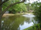 The Myrtle Trace neighborhood has ponds, mature landscaping, and Burning Ridge golf views 