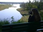 Young lady taking photos of the lagoon at Big Bay Town Park, Madeline Island