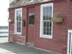 Old fisherman's shop on the dock near the harbor
