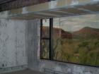Red Rock State Park - Sedona, A closeup of the large bay window in the entertainment room in the House of Apache Fire.
